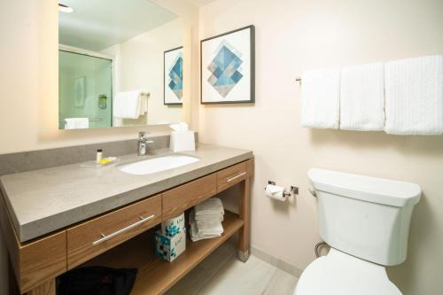 a bathroom with a sink and a toilet at Candlewood Suites Charleston – Mt. Pleasant by IHG in Charleston