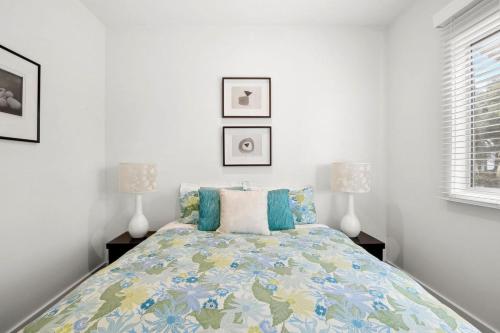 a bedroom with a bed with two lamps on it at Aireys Oasis in Aireys Inlet