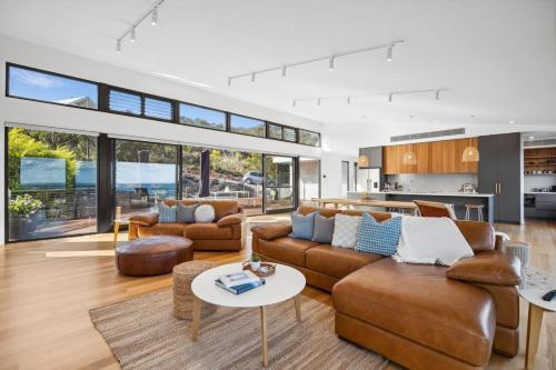 a living room with a couch and a table at Hakea Ridge in Aireys Inlet