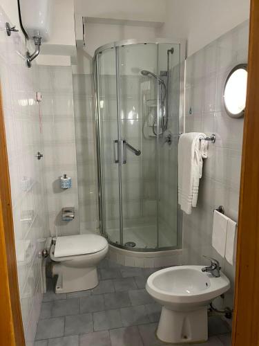 a bathroom with a shower and a toilet and a sink at Il Gabbiano in Termini Imerese