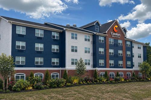 a rendering of a hotel with a building at Comfort Inn & Suites Concord - Kannapolis in Concord