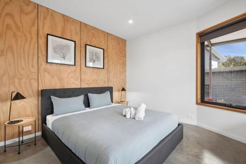 a bedroom with a large bed and a window at Bimbadeen Bliss in Aireys Inlet