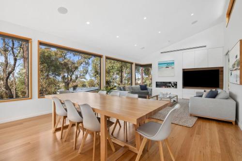 a dining room and living room with a table and chairs at Bimbadeen Bliss in Aireys Inlet
