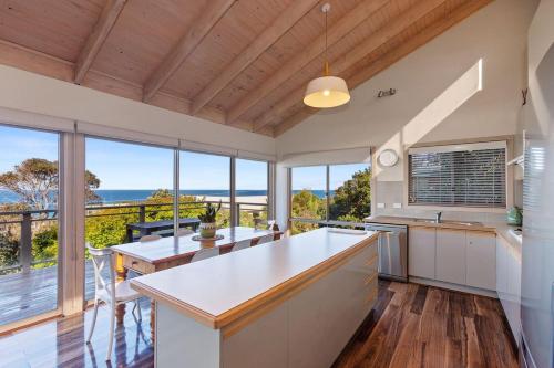 an open kitchen with a view of the ocean at Otway Views in Apollo Bay