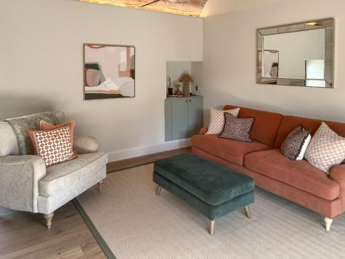 a living room with a couch and two chairs at The Lodge in Consett