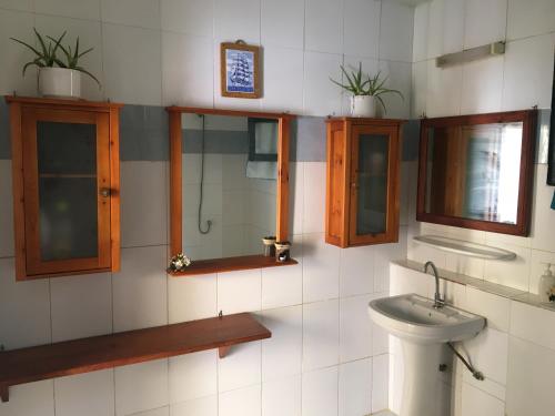 a bathroom with a sink and a toilet at Chez Eric in Gorée