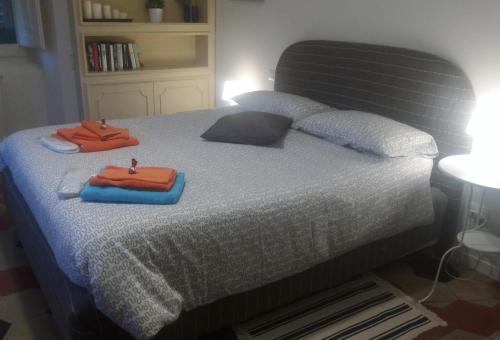a bed with two towels sitting on top of it at Casa di Marisa in Chieti