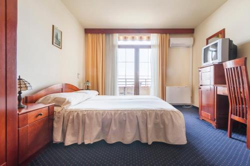 En eller flere senge i et værelse på Hotel Miramare