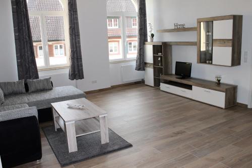 a living room with a couch and a table at Ferienwohnungen Tannenhof in Steinen