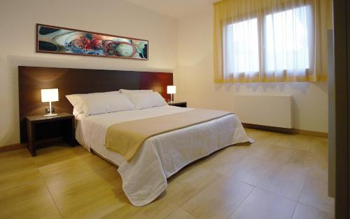 Säng eller sängar i ett rum på Catania Hills Residence