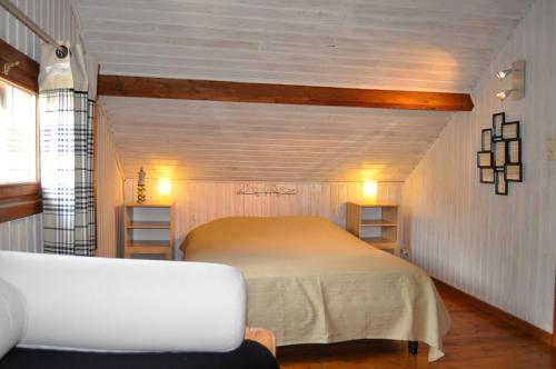 מיטה או מיטות בחדר ב-Chalet Ardenne Mini