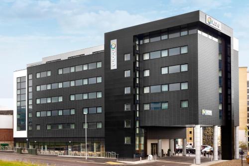 a black building with a sign on it at Ramada Encore Newcastle-Gateshead in Newcastle upon Tyne