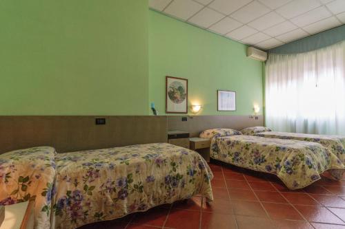 Krevet ili kreveti u jedinici u okviru objekta Hotel Il Telegrafo