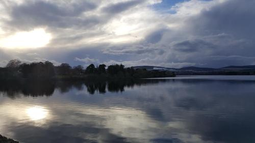 a view of a lake with a cloudy sky at Tara Hill Estate in Gorey