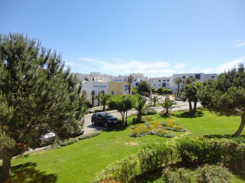 a view of a park with trees and a car at Golden Carthage Residences in Gammarth