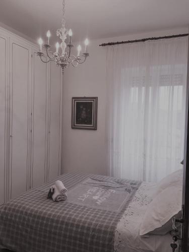 a bedroom with a teddy bear sitting on a bed at Atmosfera d'Arte - Private parking in Orvieto