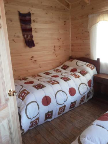 Cama o camas de una habitación en Cabañas El Sauce
