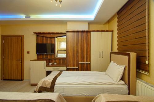 Voodi või voodid majutusasutuse Kars Konak Hotel toas
