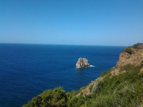 a small rock in the middle of the ocean at B&B Su Maimoni in Iglesias