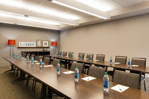 a conference room with a long table with bottles of water at Country Inn & Suites by Radisson, Houghton, MI in Houghton