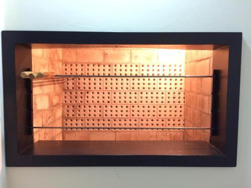 a glass exhibit of a shower in a room at Apartamento Baviera in Canela
