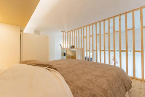 Loft with mezzanine in Baggio by Thinah