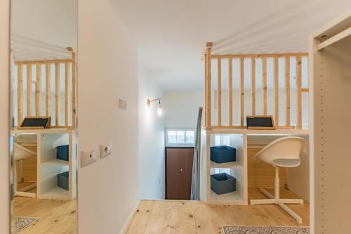 Loft with mezzanine in Baggio by Thinah