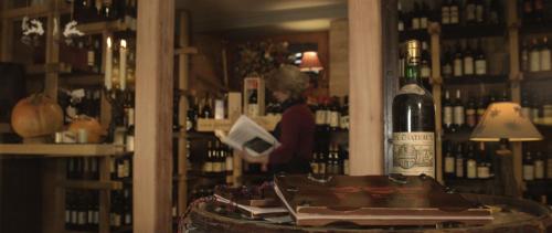 a bottle of wine sitting on a table in a store at Hotel Mignon in Breuil-Cervinia