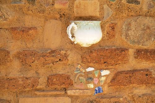 a brick wall with a white object on it at El Callejón Hotel Boutique in Oaxaca City