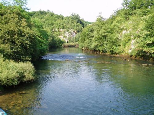 a view of a river from a bridge at Apartment Gorska vila in Ogulin