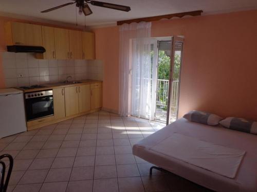 Apartments Popi - One bedroom apartment with balcony 1
