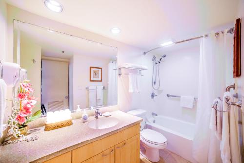 a bathroom with a sink and a toilet and a shower at Mountain View Condo, Near Beach, Free Parking! in Honolulu