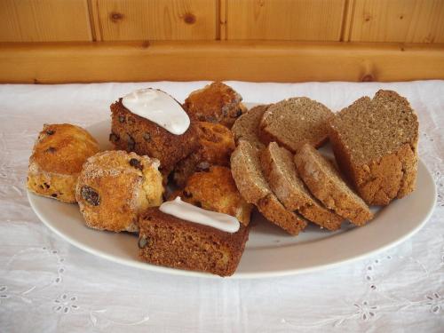 a plate of bread and pastries on a table at Maryville Bed and Breakfast in Nenagh