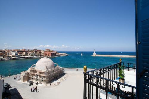 a view of the water from the balcony of a building at Suites Pandora in Chania Town