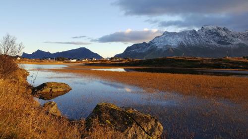 a body of water with a mountain in the background at Milas House two apartments in Fredvang