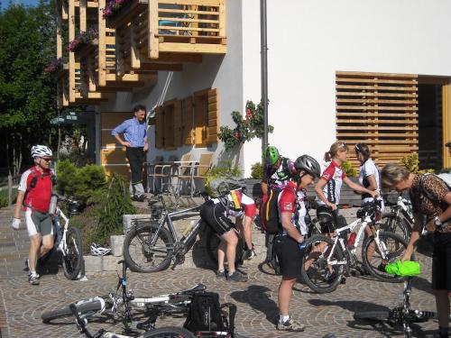 a group of people standing next to their bikes at Dolomiti Lodge Villa Gaia in Venas