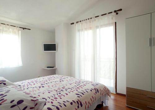 Ένα ή περισσότερα κρεβάτια σε δωμάτιο στο Holiday Home Ana