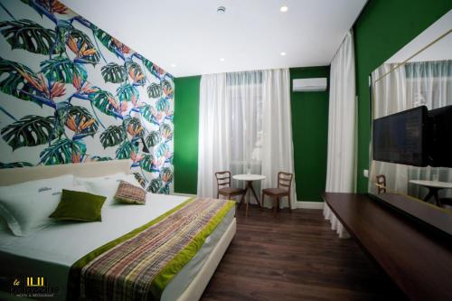 Ένα ή περισσότερα κρεβάτια σε δωμάτιο στο Le Palazzine Hotel
