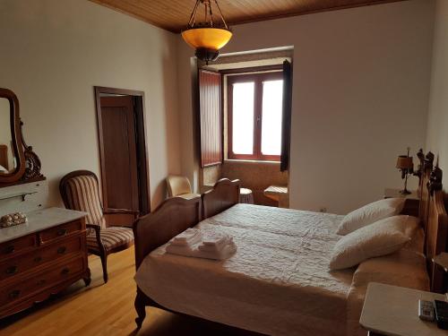 Кровать или кровати в номере Casa grande Covelinhas