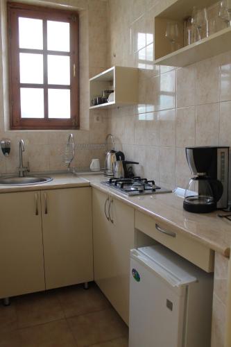 a kitchen with a sink and a counter top at House 41 in Tbilisi City
