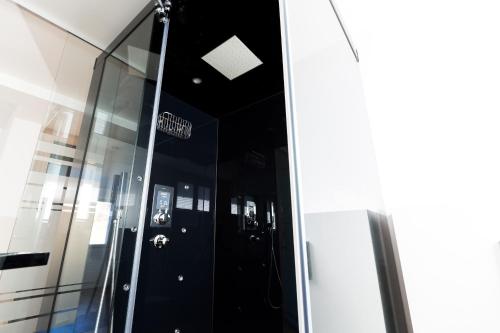 a glass door in a building with a sign on it at Pilatus Apartments in Alpnach