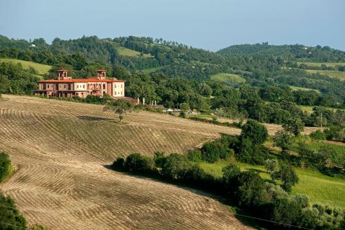 an aerial view of a house in a field at Saturnia Tuscany Country House in Saturnia