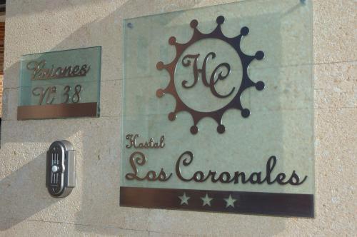 a sign for a store with a sign that reads las coronacion at Hostal Los Coronales in Madrid
