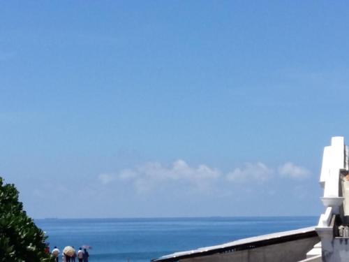 a group of people standing near the ocean at Southern Comforts - Galle Fort in Galle