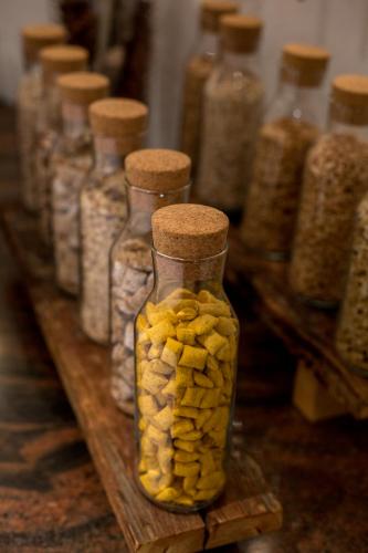 a group of glass jars filled with yellow pills at ROBINSON ALPENROSE Zürs in Zürs am Arlberg