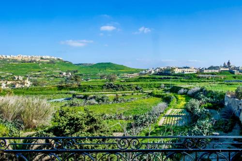 a view of a garden from a bridge at Dar tal-Kaptan Boutique Maison in Għasri