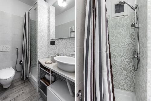 ミラノにあるKramer Apartmentのバスルーム(洗面台、トイレ、シャワー付)