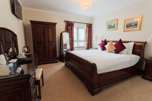 Tempat tidur dalam kamar di Chester Beatty Inn