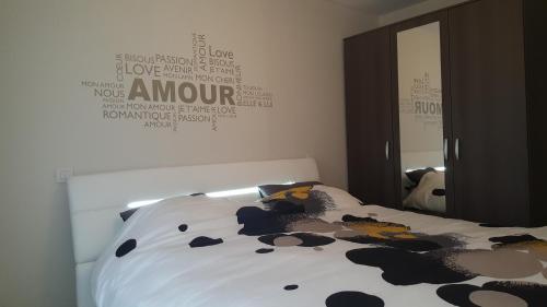 a bedroom with a bed with a cow blanket at Mainstreet Knokke in Knokke-Heist