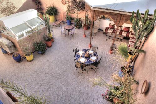 an overhead view of a patio with a table and chairs at Maison du Soleil in Tiznit